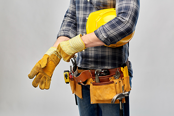 Image showing builder with gloves, helmet and working tools