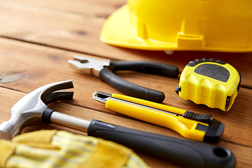 Image showing different work tools on wooden boards