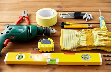 Image showing different work tools on wooden boards