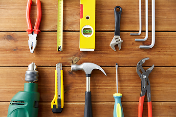 Image showing different work tools on wooden boards