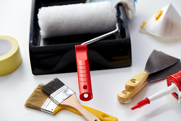 Image showing different painting work tools on white background