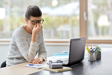 Image showing tired woman with laptop working at home office