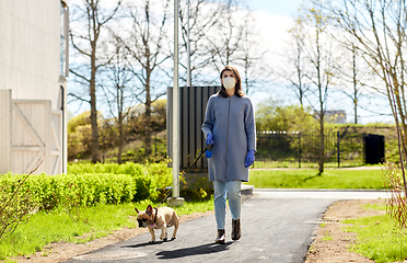 Image showing woman in mask and gloves with dog walking in city