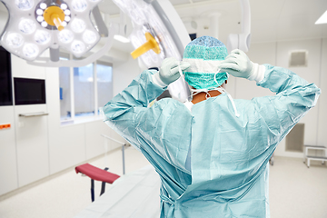 Image showing male surgeon doctor in protective wear at surgery