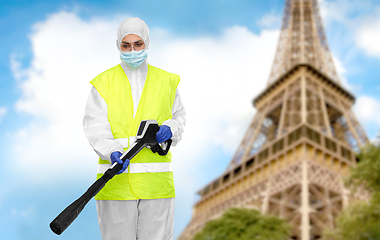 Image showing sanitation worker in hazmat with pressure washer