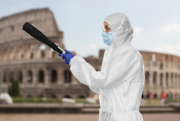 Image showing sanitation worker in hazmat with pressure washer