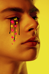 Image showing Tears illustrated of social media activity signs on male face in neon light. Real life versus online lifestyle, addiction to modern technologies