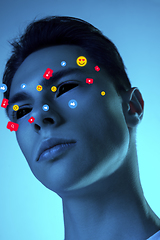 Image showing Tears illustrated of social media activity signs on male face in neon light. Real life versus online lifestyle, addiction to modern technologies