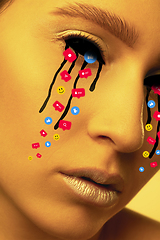 Image showing Tears illustrated of social media activity signs on female face in neon light. Real life versus online lifestyle, addiction to modern technologies