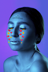 Image showing Tears illustrated of social media activity signs on female face in neon light. Real life versus online lifestyle, addiction to modern technologies