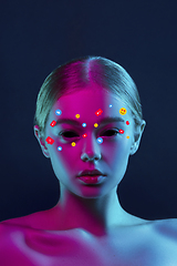 Image showing Tears illustrated of social media activity signs on female face in neon light. Real life versus online lifestyle, addiction to modern technologies