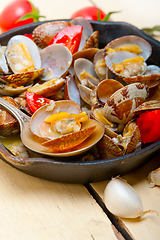 Image showing fresh clams on an iron skillet