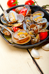 Image showing fresh clams on an iron skillet