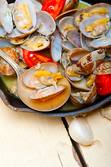 Image showing fresh clams on an iron skillet