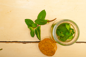 Image showing fresh mint leaves on a glass jar