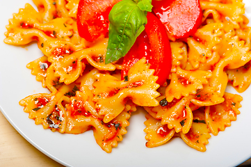 Image showing Italian pasta farfalle butterfly bow-tie and tomato sauce