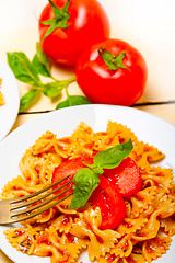 Image showing Italian pasta farfalle butterfly bow-tie and tomato sauce