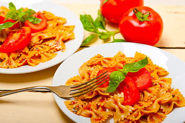 Image showing Italian pasta farfalle butterfly bow-tie and tomato sauce