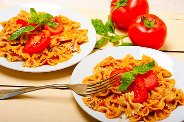 Image showing Italian pasta farfalle butterfly bow-tie and tomato sauce