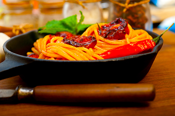 Image showing italian spaghetti pasta and tomato with mint leaves