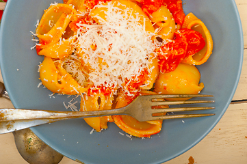 Image showing Italian snail lumaconi pasta with tomatoes