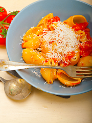 Image showing Italian snail lumaconi pasta with tomatoes