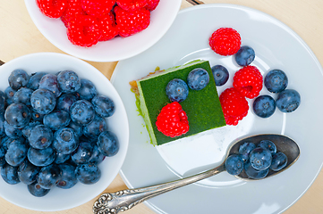 Image showing green tea matcha mousse cake with berries