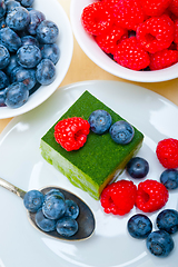 Image showing green tea matcha mousse cake with berries