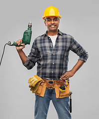 Image showing happy indian builder in helmet with electric drill