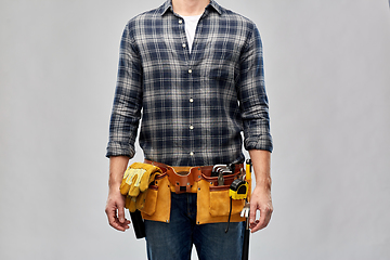 Image showing male worker or builder with working tools on belt