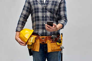Image showing worker or builder with phone and working tools