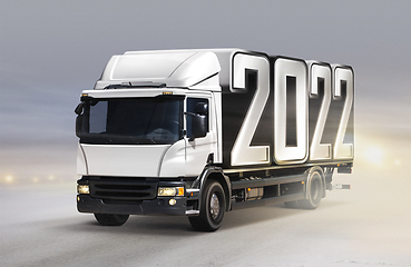 Image showing truck delivers 2022 by new year in winter