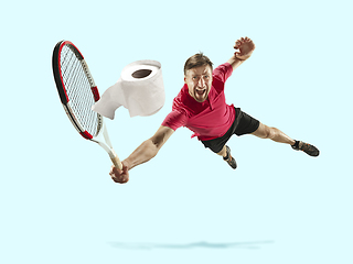 Image showing Professional sportsman caught toiletpaper in motion and action - high demand for essential goods