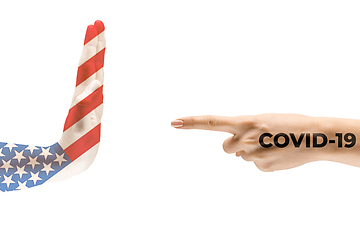 Image showing Stop the epidemic. Human hands colored in flag of USA and coronavirus - concept of spreading of virus