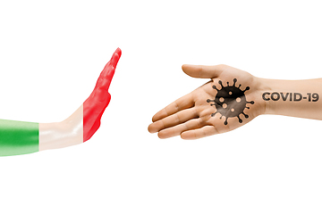 Image showing Stop shaking hands. Human hands colored in flag of Italy and coronavirus - concept of spreading of virus