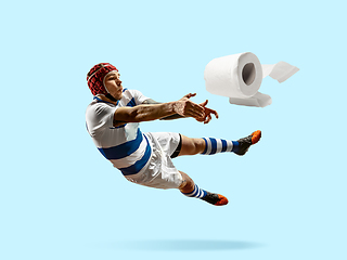 Image showing Professional sportsman caught toiletpaper in motion and action - high demand for essential goods