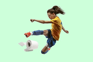 Image showing Professional sportswoman caught toiletpaper in motion and action - high demand for essential goods