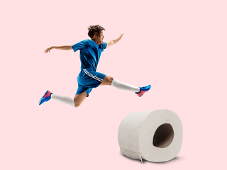 Image showing Professional sportsman caught toiletpaper in motion and action - high demand for essential goods