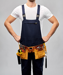 Image showing worker or builder in overall with working tools