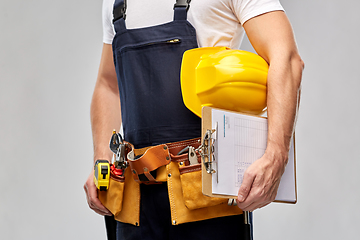 Image showing male builder with clipboard and working tools