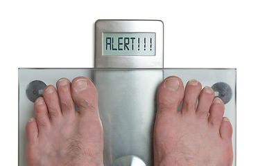 Image showing Man\'s feet on weight scale - Alert