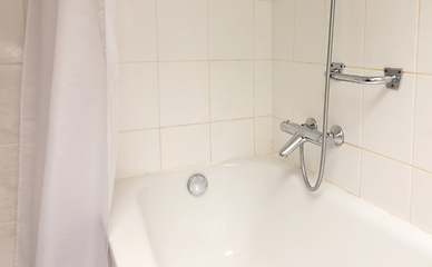 Image showing Bathtub in a tiled bathroom