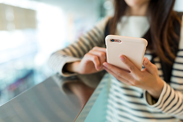 Image showing Woman use of mobile phone in shopping mall