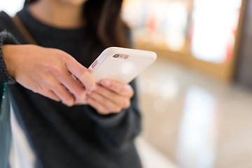 Image showing Woman using mobile phone to online