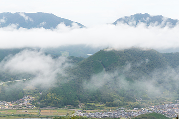 Image showing Sea of cloud in the mountain and village