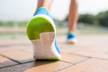 Image showing Woman running at city