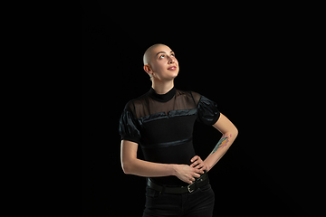 Image showing Monochrome portrait of young caucasian bald woman on black background