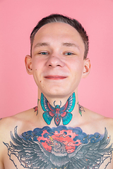 Image showing Portrait of young man with freaky appearance on pink background