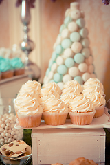 Image showing sweets on the wedding table. Vintage color.