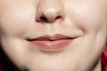 Image showing Close-up female mouth with natural lips make-up. Cosmetology, dentistry and beauty care, human emotions